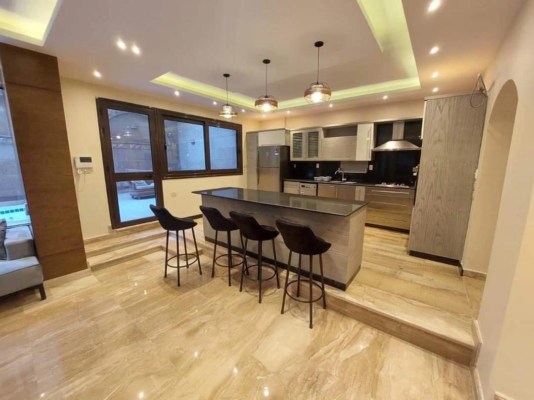 DELIGHTFUL MODERN GROUND FLOOR WITH SWIMMING POOL FOR RENT IN SARAYAT EL MAADI CAIRO EGYPT