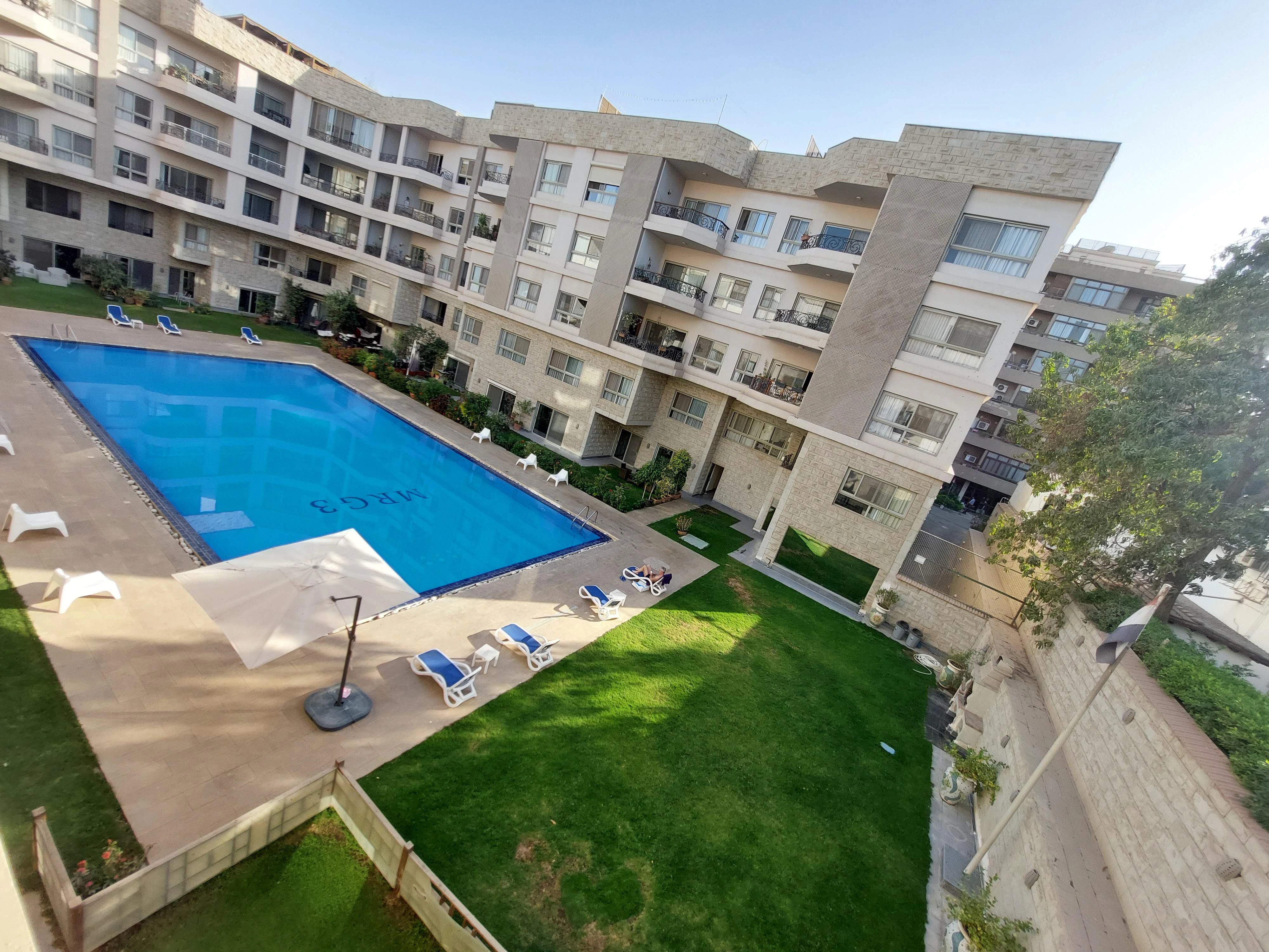 SUNNY FURNISHED  APARTMENT WITH SHARED SWIMMING POOL FOR RENT IN SARAYAT EL MAADI CAIRO EGYPT